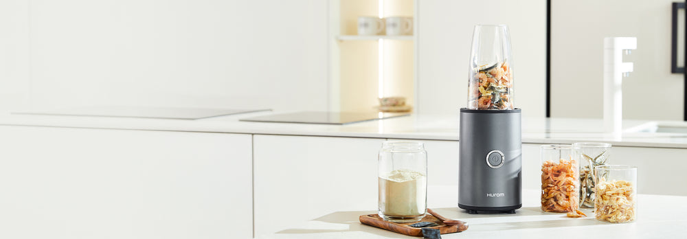 Blender with ingredients on a kitchen counter with a white background Power Blender BL-D01